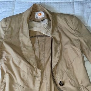 Its from 3 seasons ago missing a button has shoulder pads. Fits small